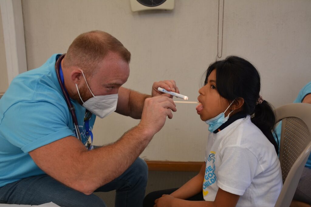 a doctor checking a patient s blood pressure