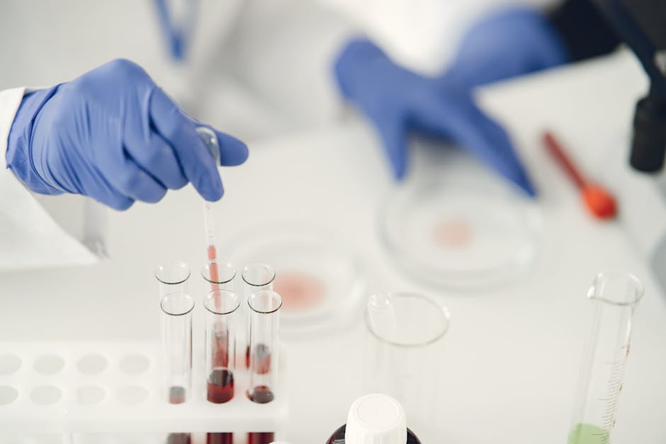 a scientist using pipette for chemical analysis in a laborat