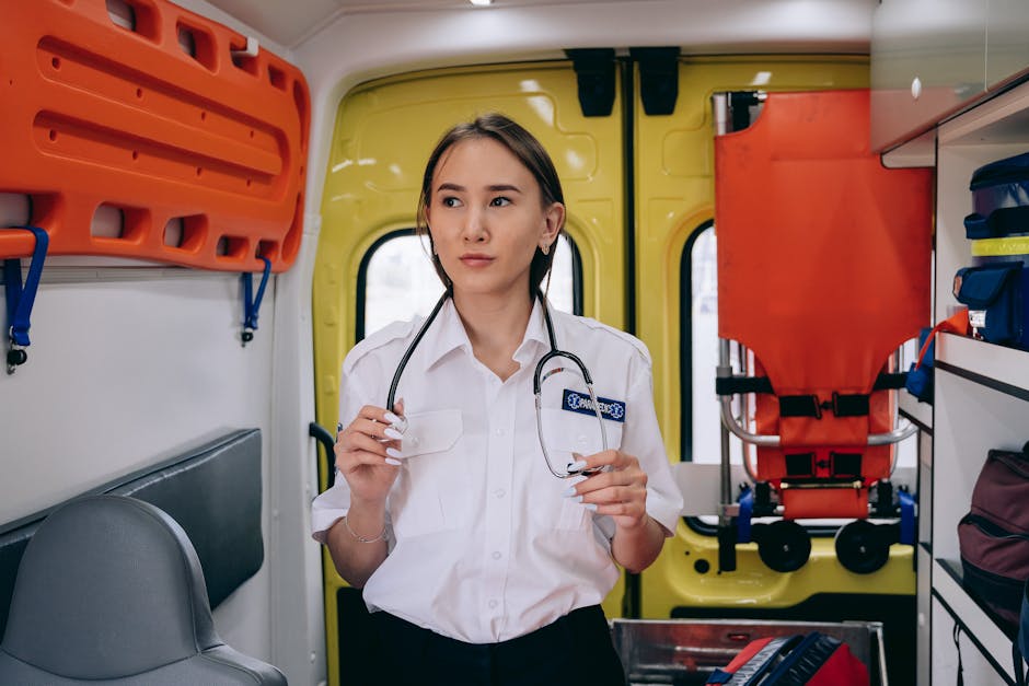portrait of a female paramedic holding a stethoscope inside
