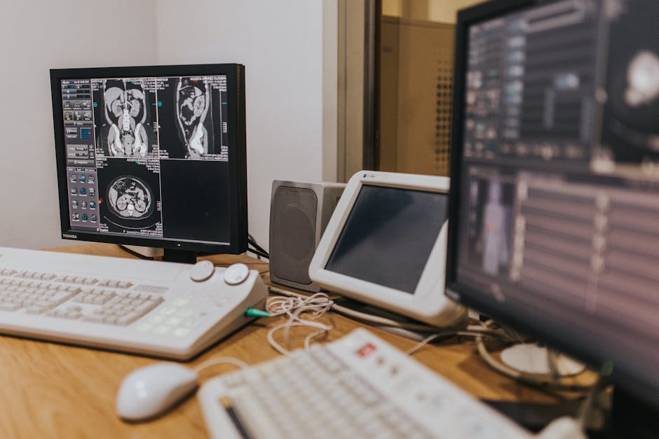 medical imaging setup with mri scans on multiple screens in